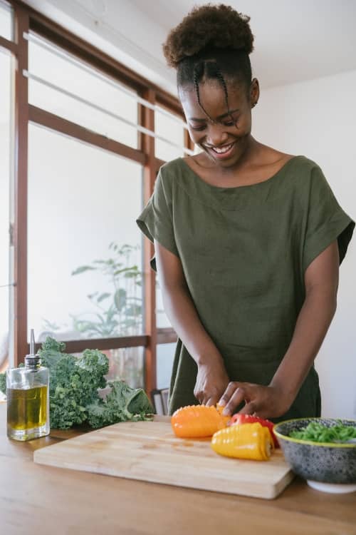 Woman Cuts Bell Pepper